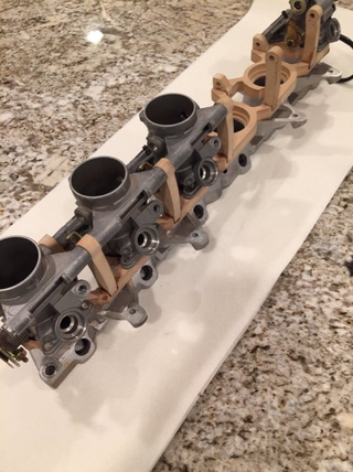 Mocking up individual throttle bodies using MDF.